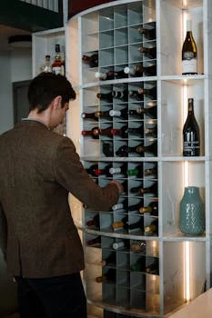 sommelier selecting wine bottles for pairing